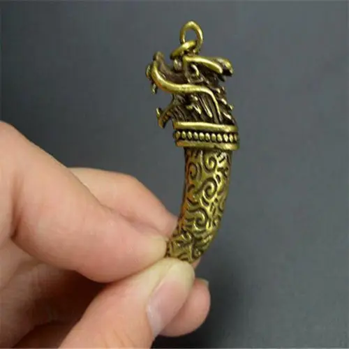 

Chinese brass dragon head Wolf tooth Exquisite Small pendant Statues