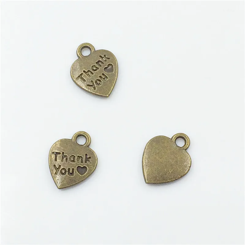 

High Quality 100 Pieces/Lot 10.3mm*13mm Antique Bronze Plated Heart Shaped Thank You Tag Charm For Jewelry Making