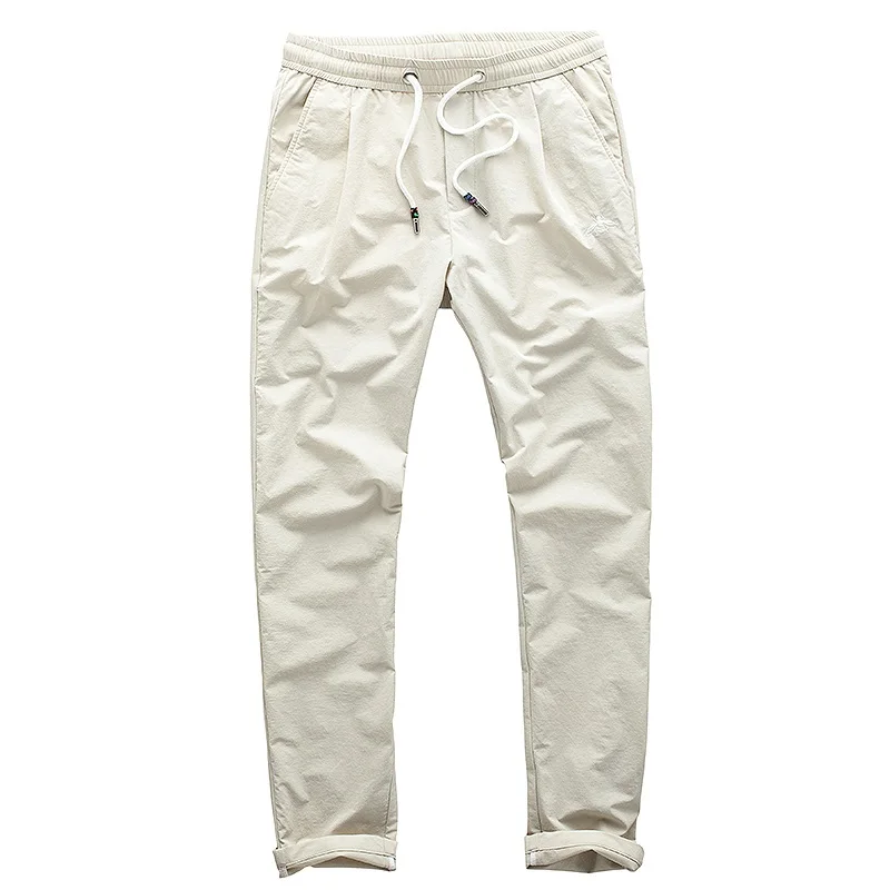 Повседневные брюки для мужчин тонкие весенне-летние без глажки узкие штаны из