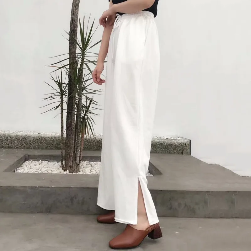 Женские брюки с разрезом TWOTWINSTYLE эластичные высокой талией и карманами на