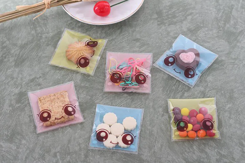 Сумка для упаковки конфет с рисунком большие глаза девочек 100 шт. 7*10 см