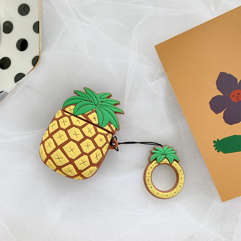 Чехол для AirPods со забавной карикатурой ананаса, защищающий их силиконовым покрытием и имеющий кольцо для пальца.