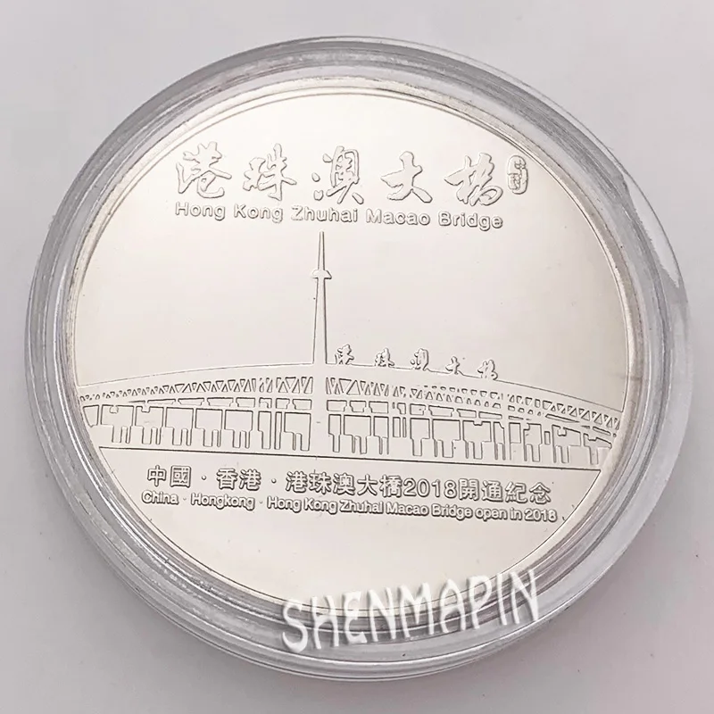 Мост Гонконг-Чжухай-Макао успешно открылся для движения памятных монет один из