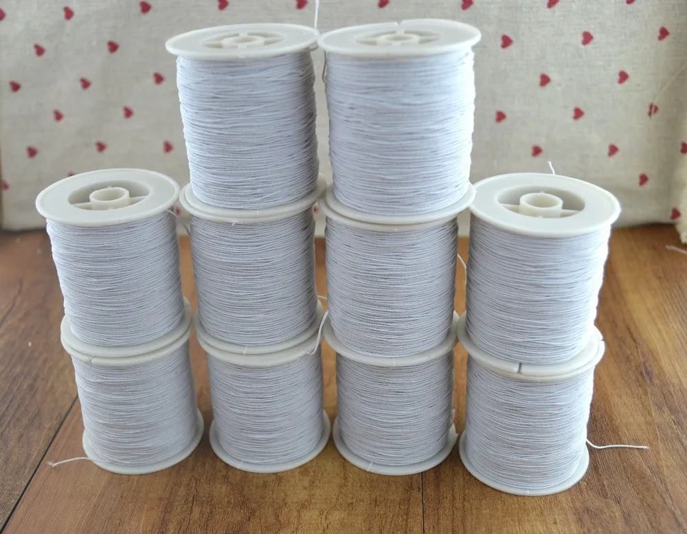 

White Elastic Thread household thread 200M per roll 10 rolls / pack ,total 2000 M from 0.05mm sewing suppliers Free shipping.