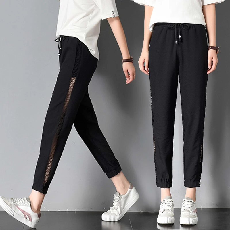 

New large size female pants summer thin section loose harem pants was thin black hollow nine points carrot pants TB18100