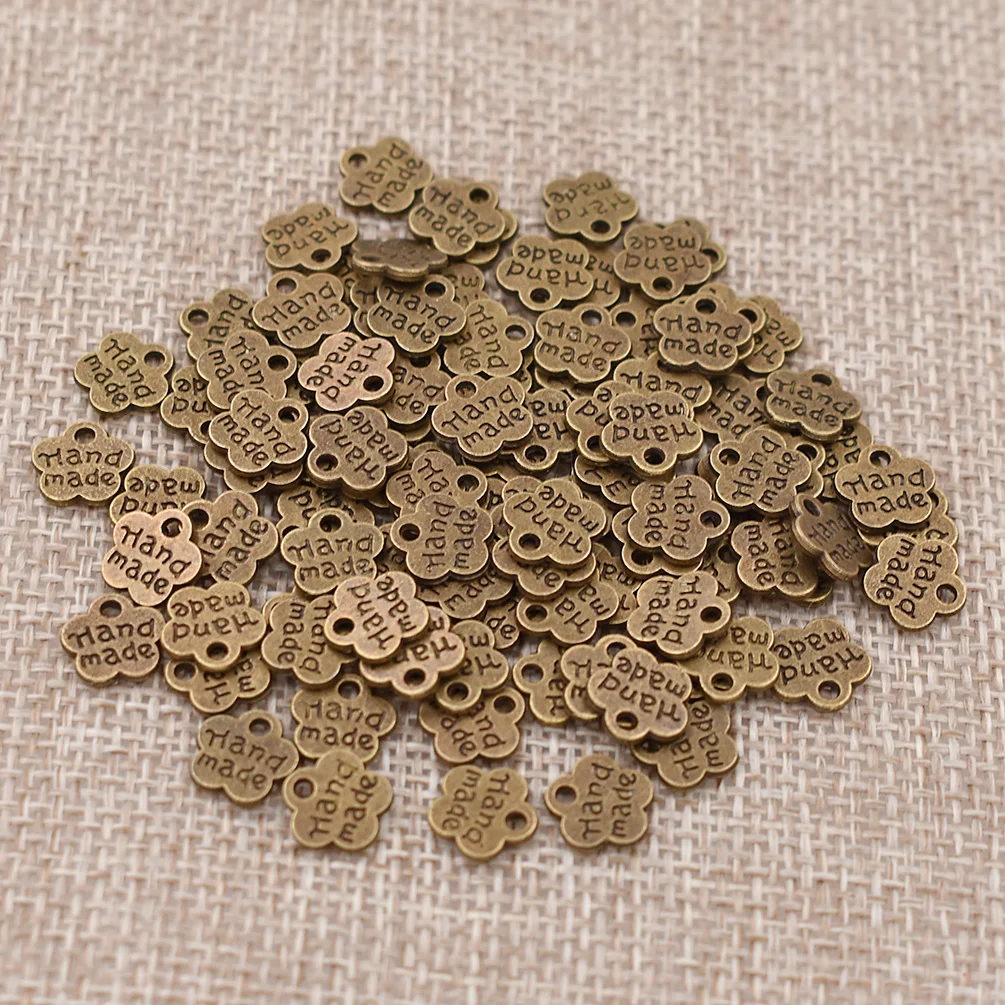 Ancient bronze 100 шт. винтажные металлические этикетки в форме цветка сливы ручной работы для рукоделия бирки для одежды DIY Швейные принадлежности - Цвет: Ancient bronze