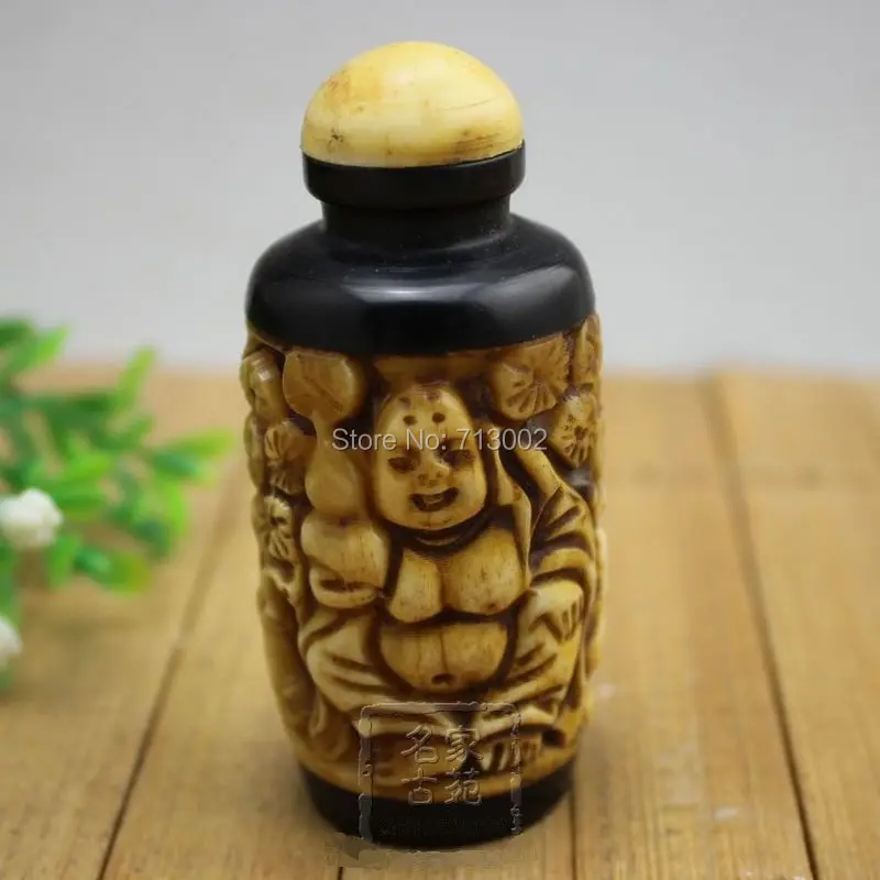 

VINTAGE CARVED CHINESE OLD BONE BUDDHA SNUFF BOTTLE