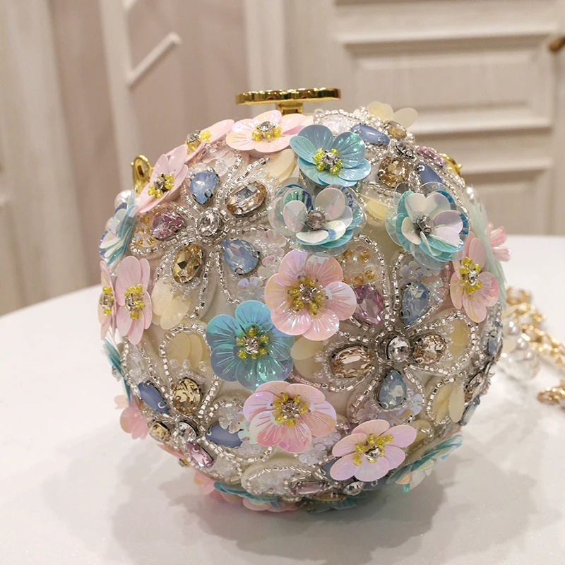 

Spring new tide female hand flowers inlaid with water drill single shoulder hand-held slant with pearl ball round bag