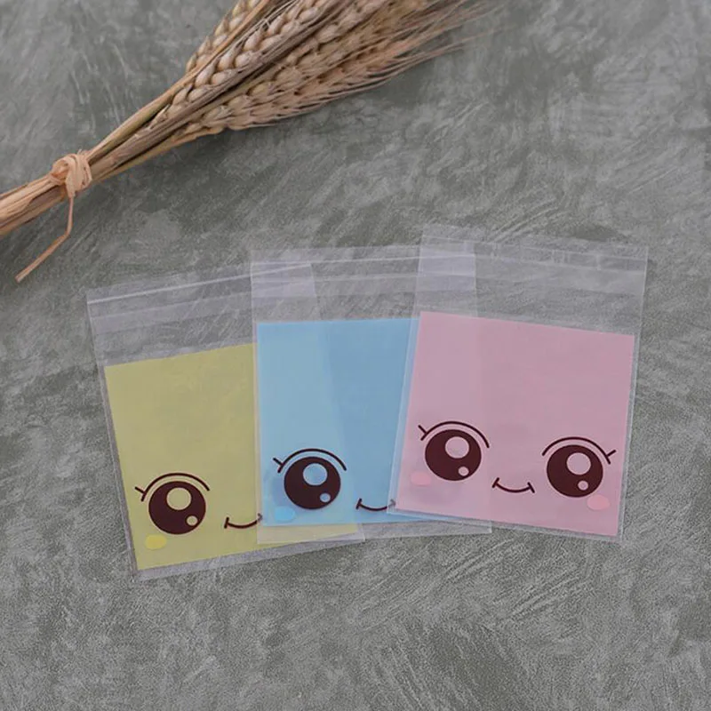 Сумка для упаковки конфет с рисунком большие глаза девочек 100 шт. 7*10 см