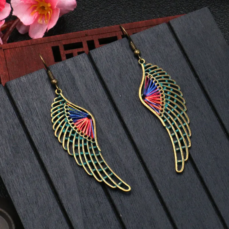 

Women Bohemian RetroHot Fashion Jewelry Angel Wings Drop Earrings Hollow Wings Dangle Earring