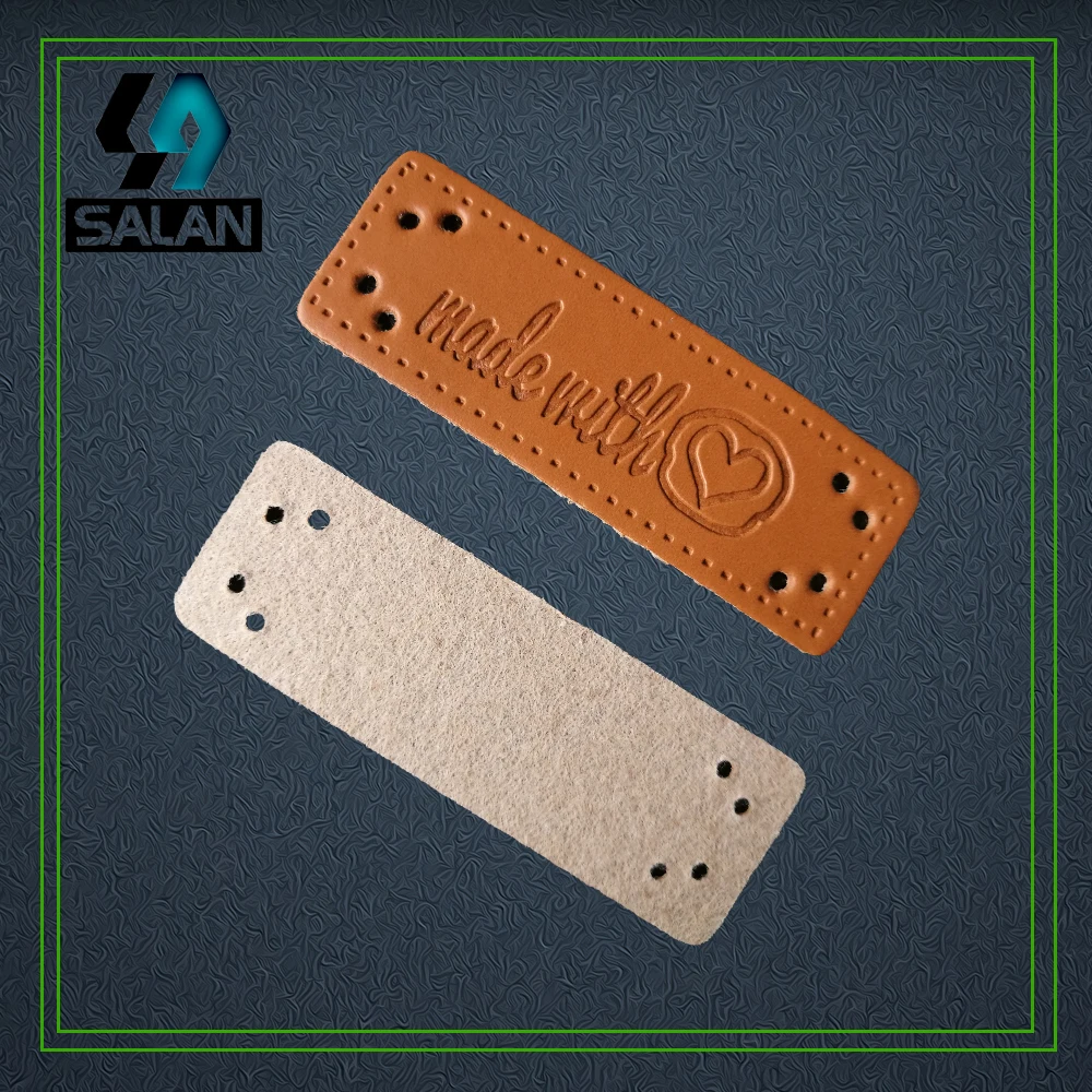 Оптовая продажа в наличии кожаные этикетки форме сердца бирки для шитья