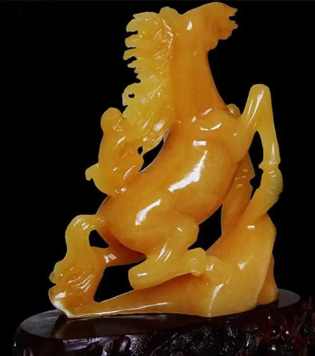 

A pair of beige and jade ornaments