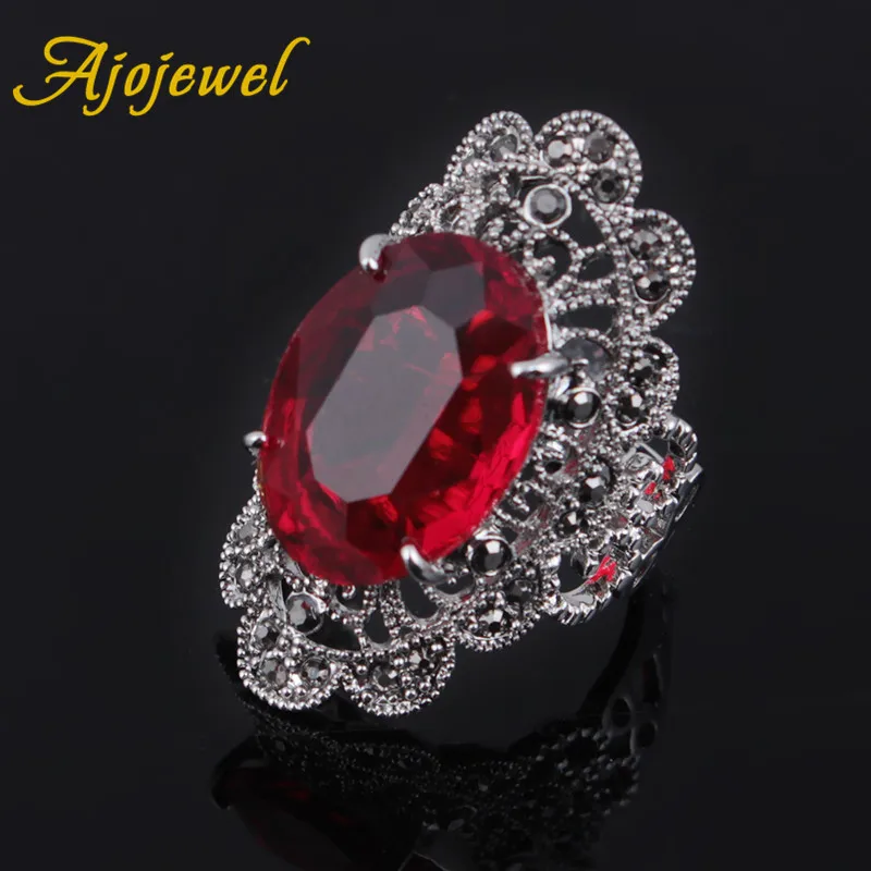 Женское кольцо с красным камнем Ajojewel черные стразы полыми цветами и