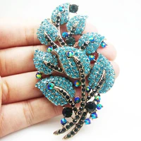 gold tone vintage blue crystal rhinestone leaf woman art style brooch pin