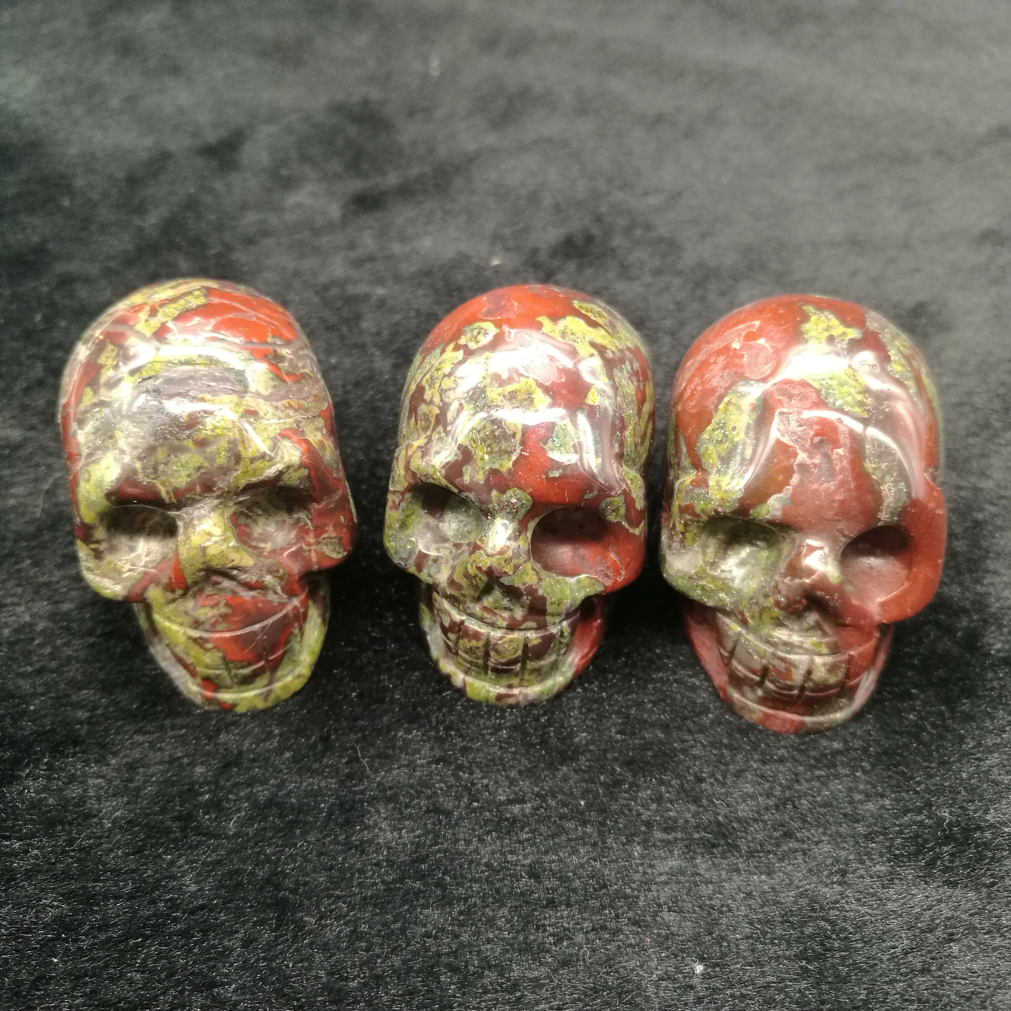 

natural beautiful dragon blood stone quartz crystal hand carved skull shape stone reiki healing home decoration for sale 1pcs