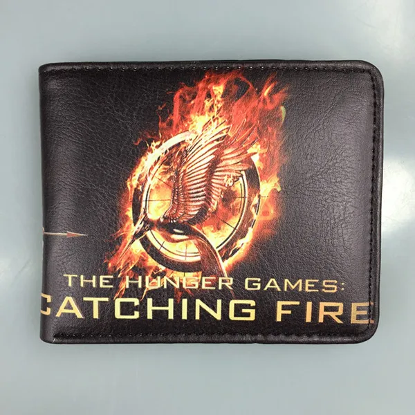 The movie hunger games около трех значков разделяющая птица смеется над кошельком Голодные
