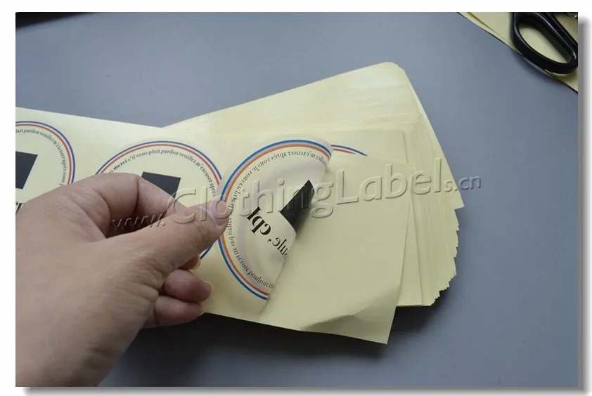 

Clear PET clothing stickers with brand logo, round shape, cut in piece. Accept small order