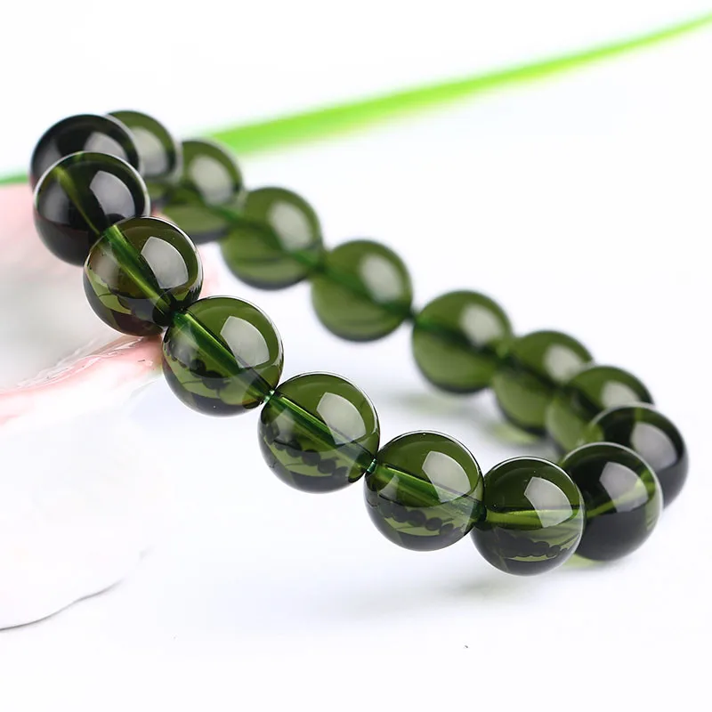 Естественный Moldavite зеленый аэролиты Чешский метеоритов с украшением в виде