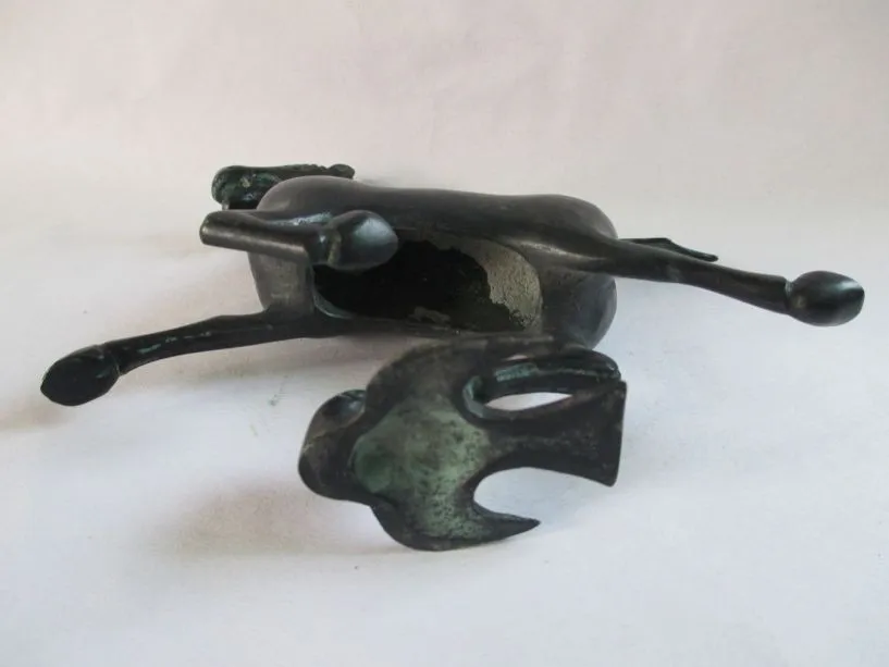 

Ancient Chinese bronze statue. The horse stepped the swallow