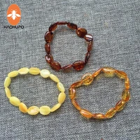 haohupo handmade 100 natural oval shape amber jewelry olive style baltic polished amber bracelet for women elastic jewelry bead