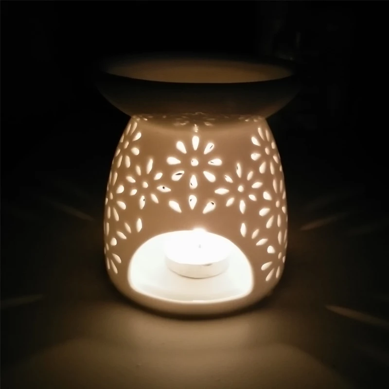 

Romantic classical handmade white hollow ceramic stove aromatherapy candle lamp for home decoration