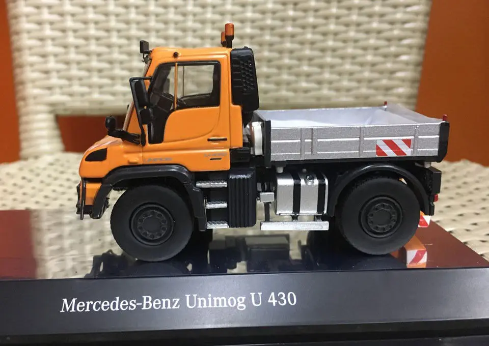 Mercedes-Benz Unimog U 430 с комбинированной косилкой оранжевый 1/50 от NZG 9101
