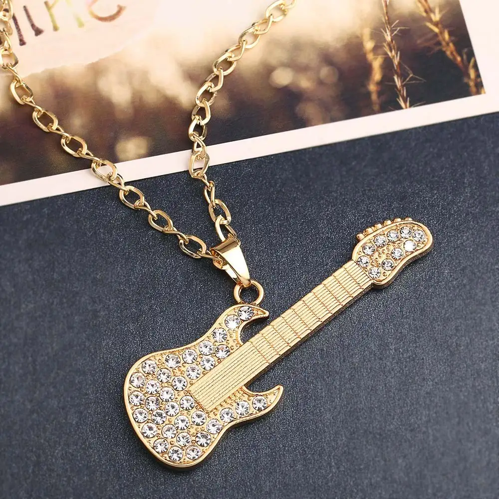 Крутое золотистое большое колье с кулоном гитара хрустальной музыкой золотая