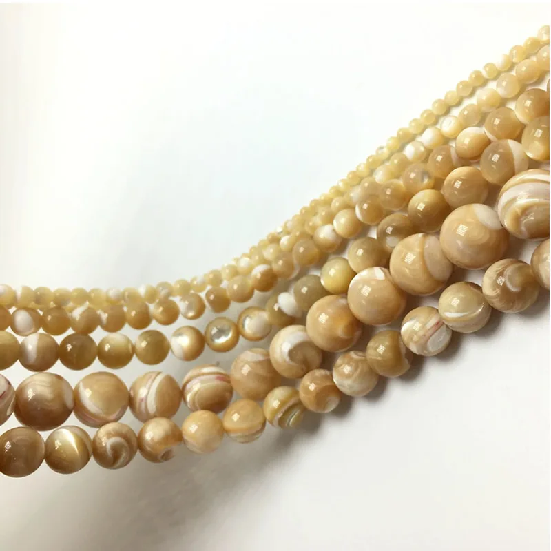 Бусины для изготовления ювелирных изделий Круглые коричневые с ракушками