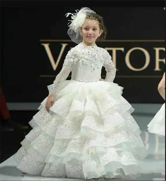 

Gorgeous Tiered Flower Girl Dress For Wedding Party Full Sleeves Crystals 3D Floral Appliques Glitz Long Pageant Gowns