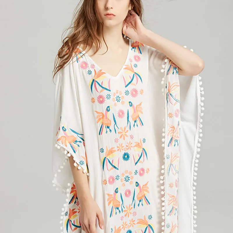 

Summer new travel Bohemian island holiday embroidery flower bird ball tassel blouse loose large size v-neck irregular dress