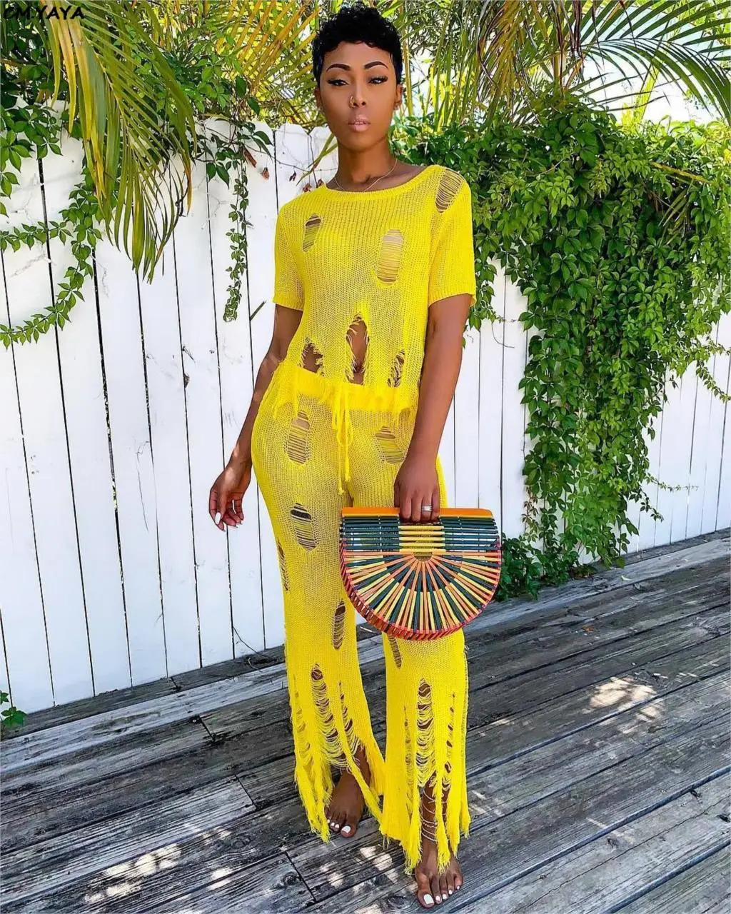 Женский трикотажный костюм из двух предметов свитер с вырезами и брюки широкими