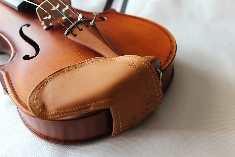 

Free shipping Fom Brand sheepskin Size 4/4 and 3/4 violin Chinrest cover geniune leather different size for choice