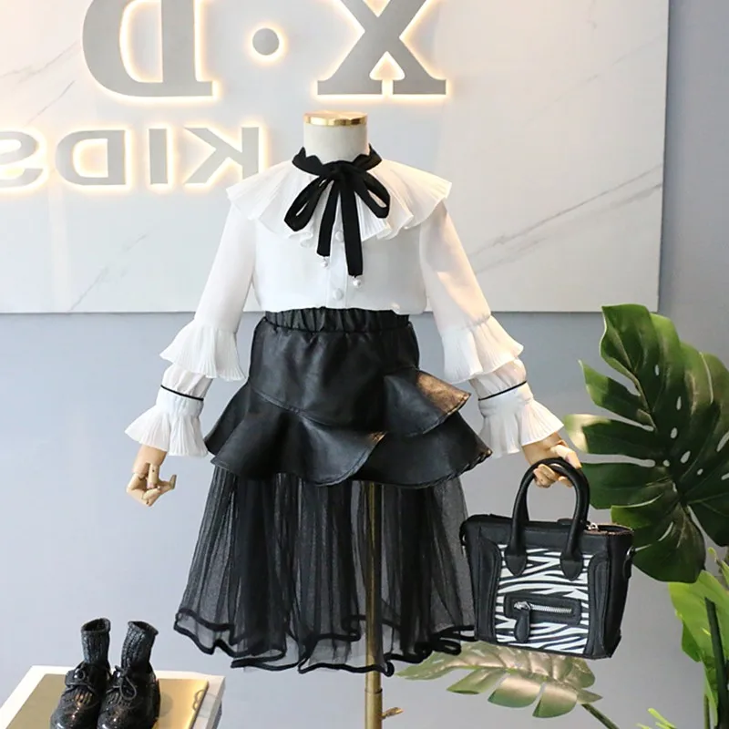 

Girls baby Pu leather skirts 2019 summer new fashion mesh patchwork skirts for children toddler cute ruffles black skirts ws529