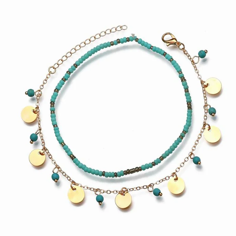 Женский браслет на щиколотке с двойной цепочкой украшенный зелеными камнями и