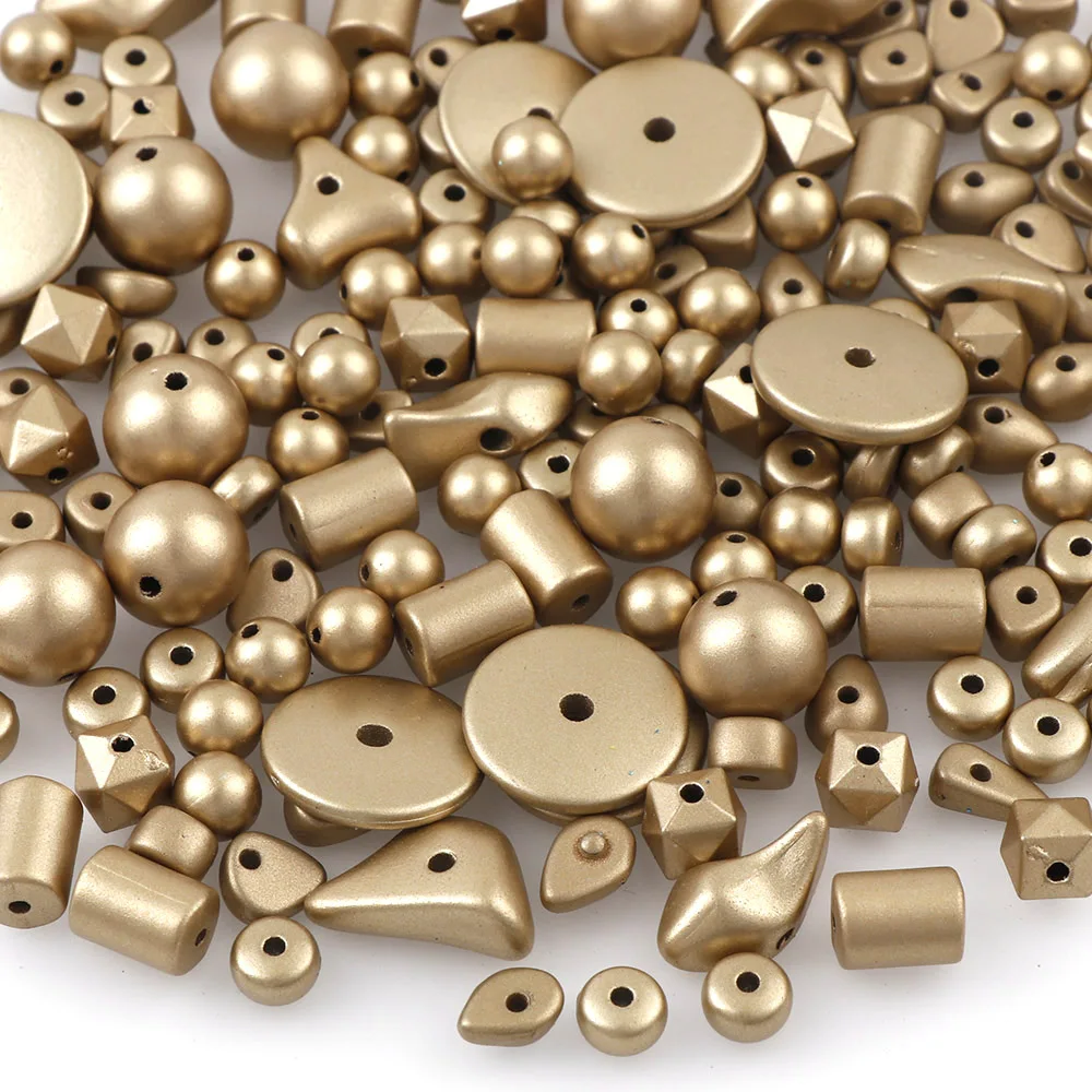 Пластиковые шарики разных форм матовые золотого цвета 50 г (приблизительно 180 шт.)