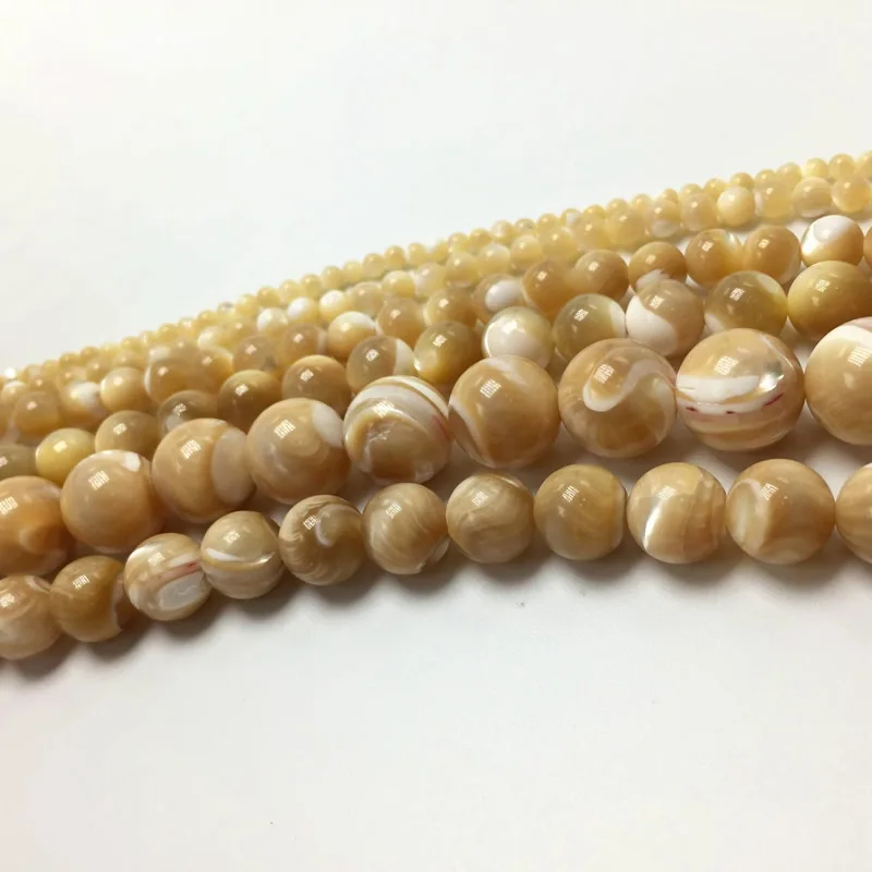 Бусины для изготовления ювелирных изделий Круглые коричневые с ракушками