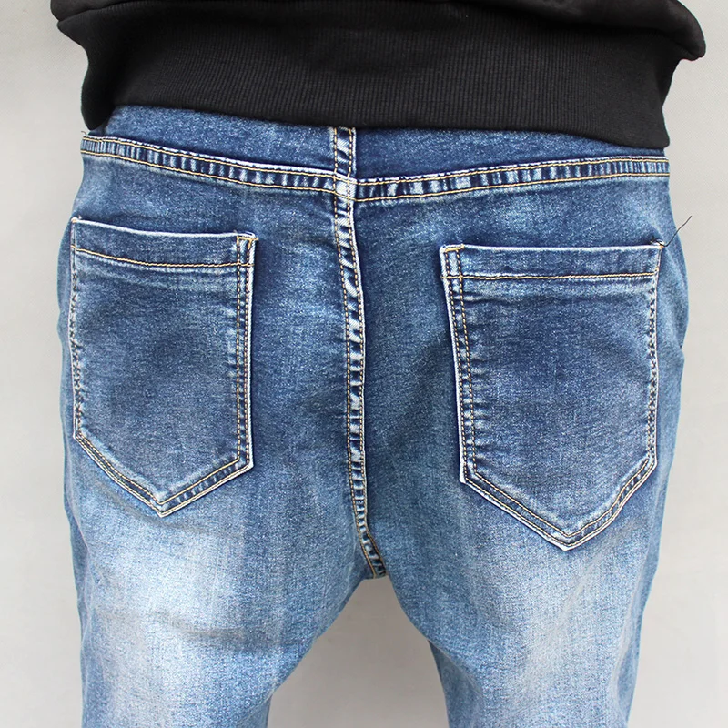 

New Arrival Winter Men's Loose Casual Jeans Fashion Brand Elastic Pure Color Haren Trousers Large Size 27 31 33 35 37 37 41 44