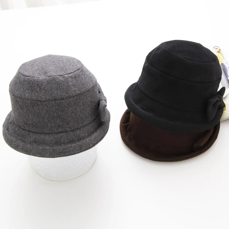 

Free shipping High Quality Casual Woman Fedoras Wool Bucket Caps Classic Bow Elegance Warm Soft Short Brim Round Caps Bowler Hat