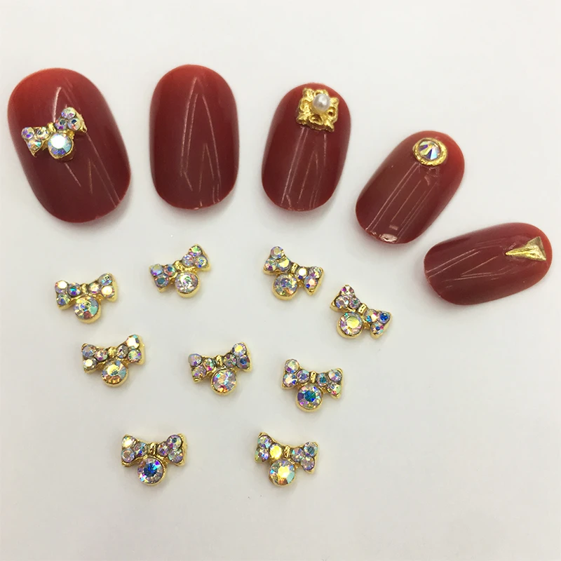 

LEAMX 10 PCS/bag Bow Nails Art Decorations 3D Bow AB Rhinestone Gold Metal Nail Jewelry Accessories DIY Rainbow ShiningL425
