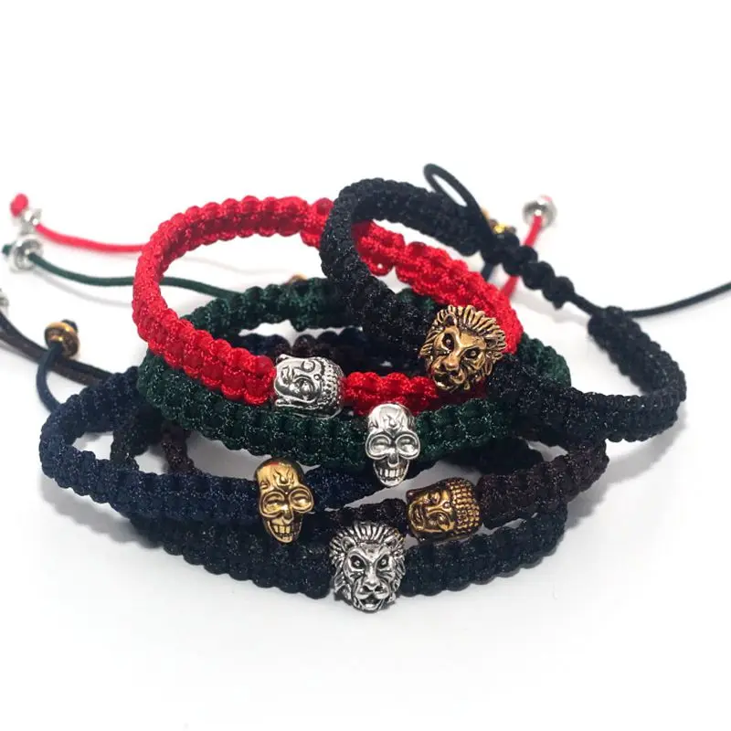 Мужской браслет макраме из черного веречка с серебряным и золотым черепом львом