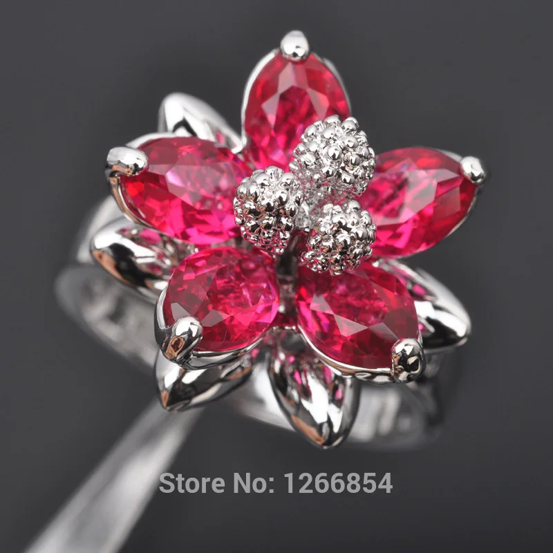 Женское серебряное кольцо с красным камнем и кубическим цирконием бесплатная