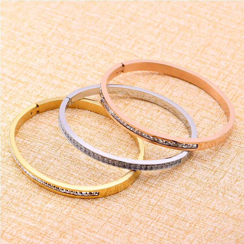 Женский браслет из нержавеющей стали с фианитом золотистый кристаллами