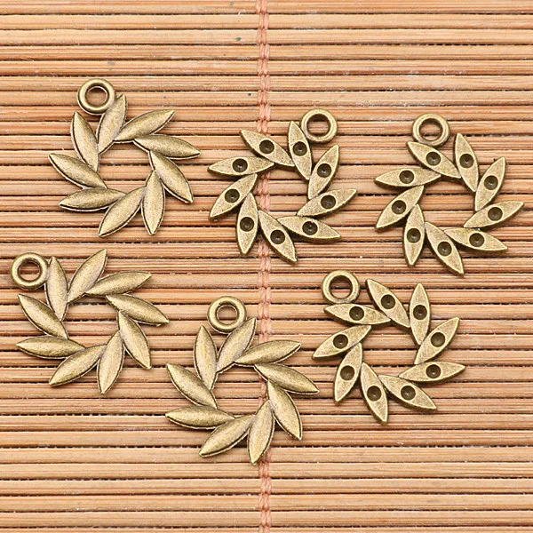 

60pcs antiqued bronze tone swirled leaf round charms h3776