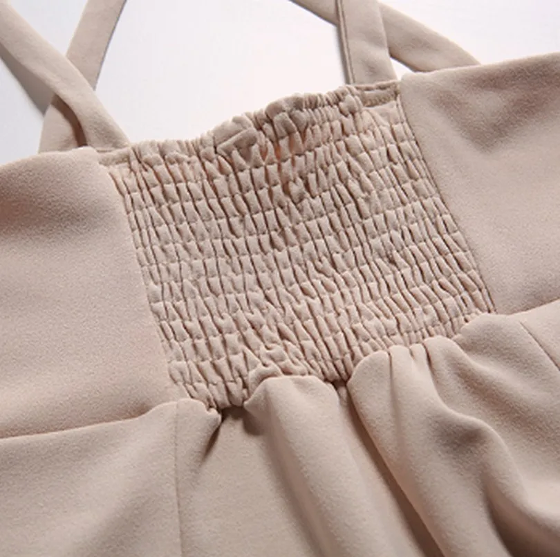 Женский комбинезон с широкими штанинами и перекрестными ремешками на спине