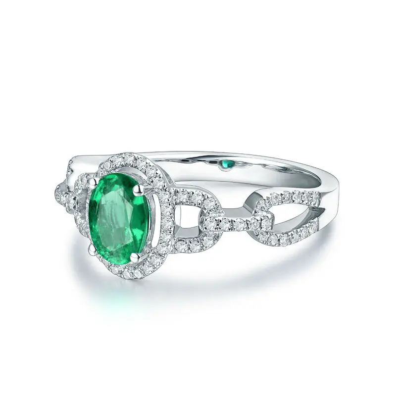 Женское кольцо с овальным камнем 5 х7 мм из твердого белого золота 14 карат зеленым