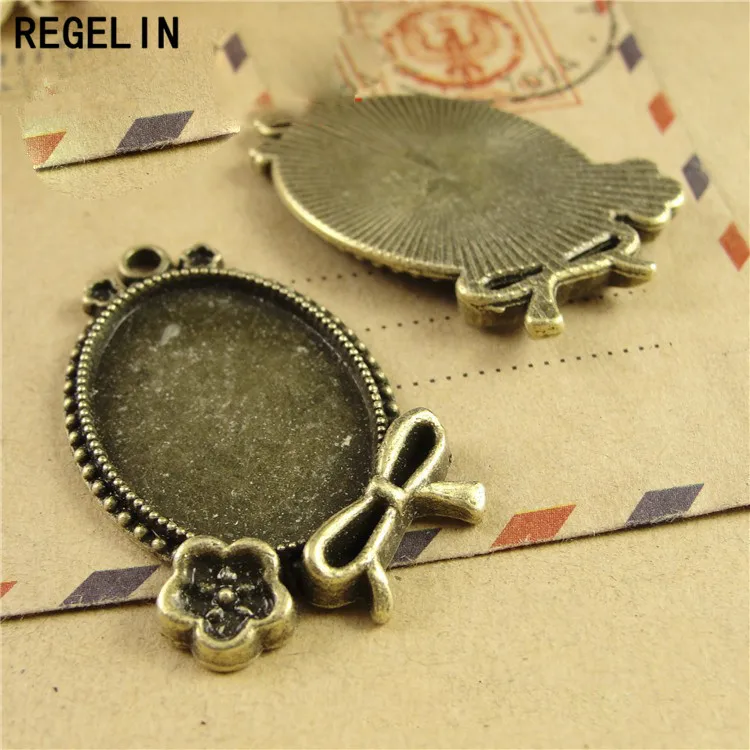 

REGELIN 10pcs vintage silver filigree cameo cabochon base setting pendant tray Fit18*25mm dia Jewelry Blanks Jewelry Accessories