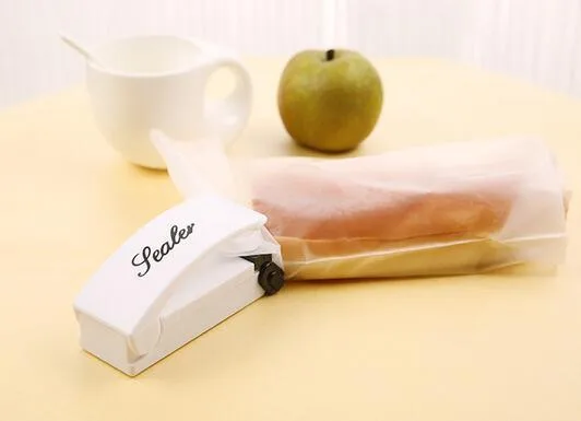 

Magic Sealer Plastic Bags Household Mini Hand Pressure Type Sealing Machine portable food sealer 100 pcs