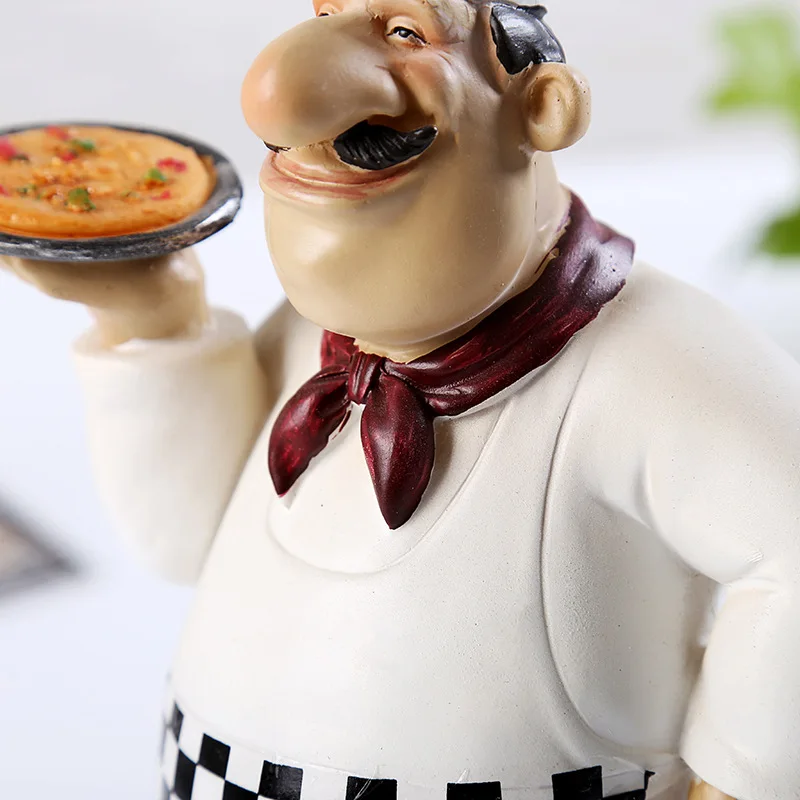 Шеф-повар Среднего Востока удерживает пиццу декоративные фигурки фаст-фуд