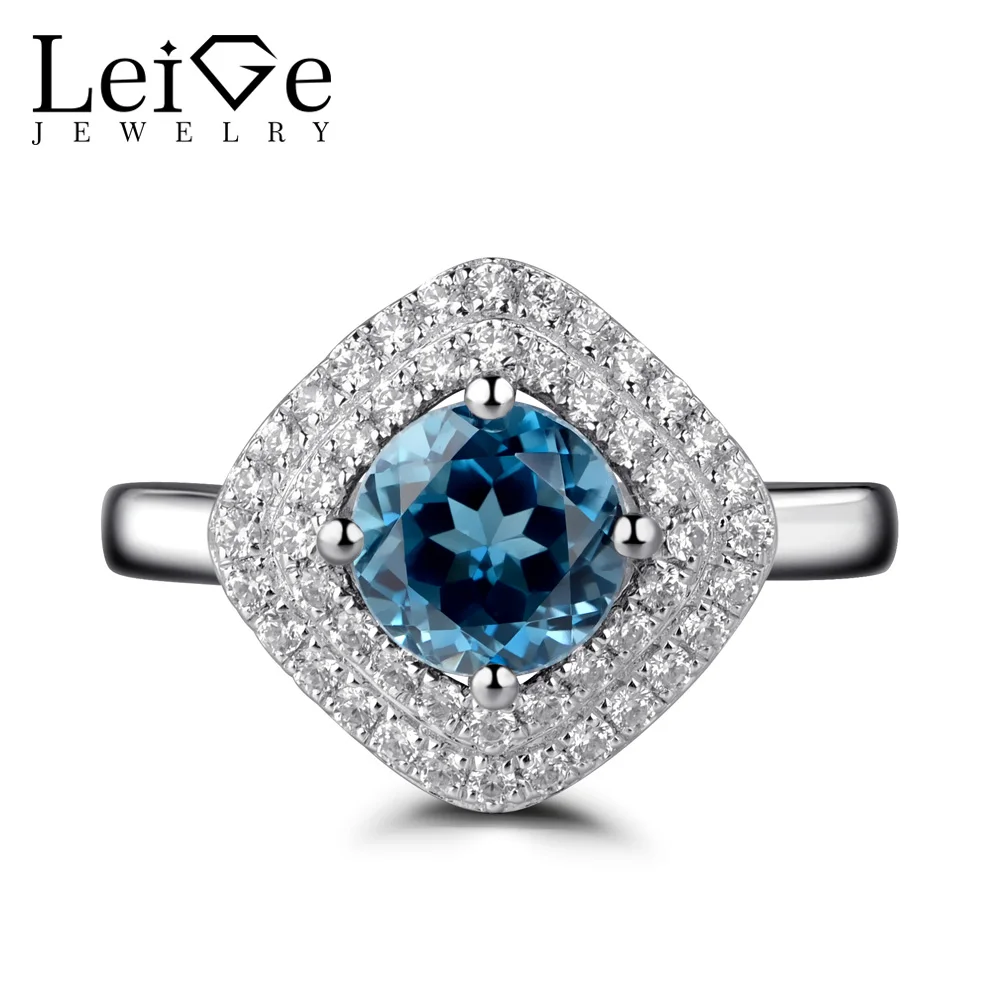 Женское кольцо с голубым топазом обручальное драгоценным камнем круглой огранки