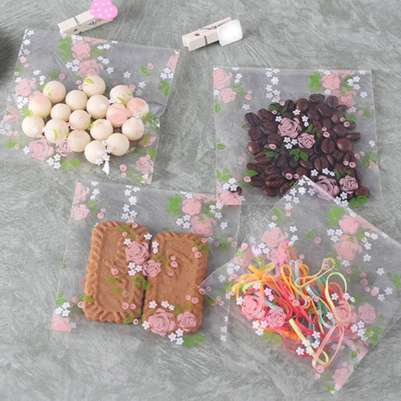 

Sale 100PCS/Lot Transparent Japanese fresh rose self-adhesive gift jewelry bag Wedding Candy Party Decoration Bag